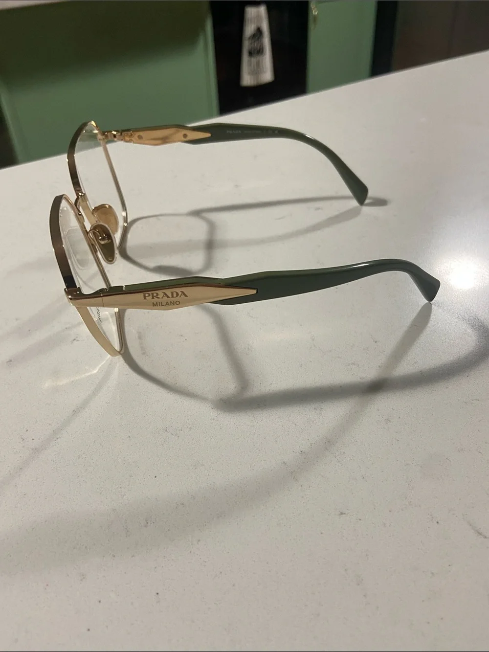Prada Gold Hexagonal Metal Frame Glasses with Clear Lenses and green arms